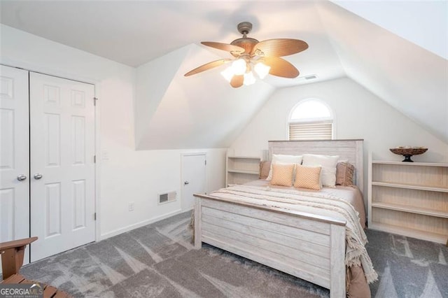 bedroom with visible vents, ceiling fan, carpet, vaulted ceiling, and a closet