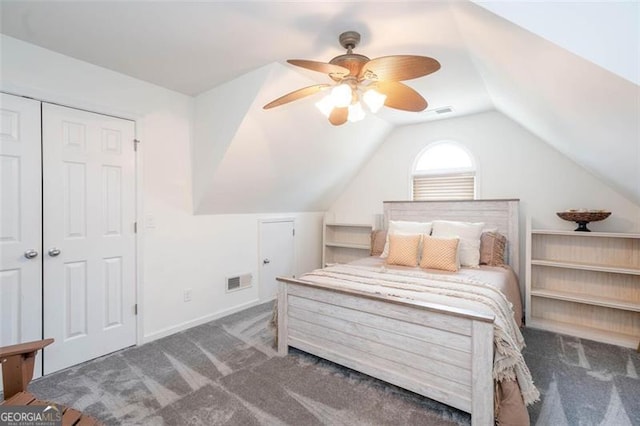 bedroom with visible vents, a ceiling fan, carpet flooring, and vaulted ceiling