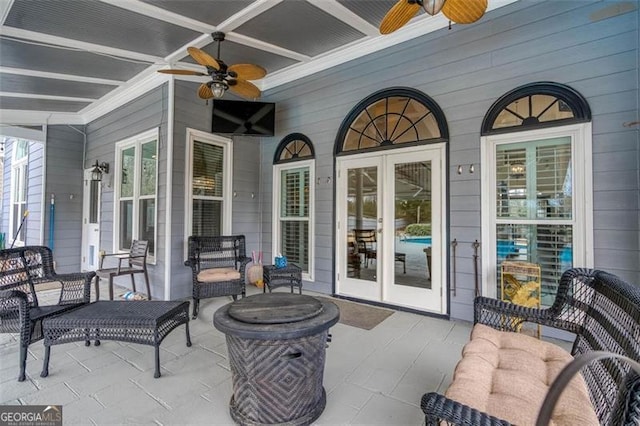 view of patio / terrace featuring a ceiling fan and french doors