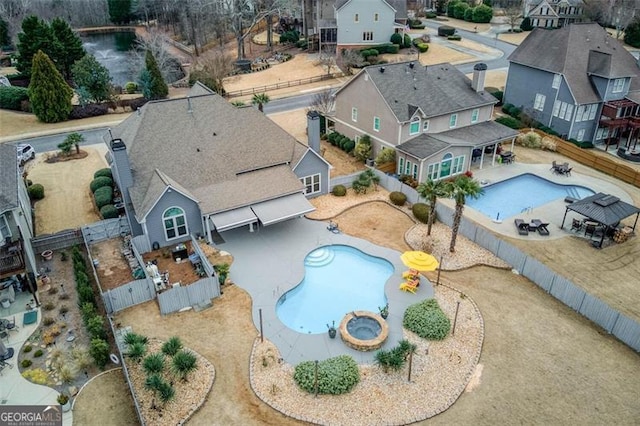 birds eye view of property with a residential view