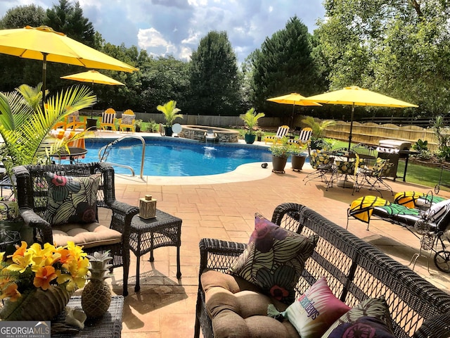 view of swimming pool with a patio, an outdoor hangout area, grilling area, a fenced backyard, and a pool with connected hot tub