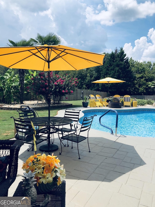 view of pool with fence, a fenced in pool, and a patio area