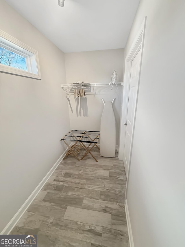 spacious closet with wood finished floors