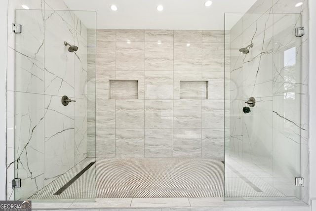 full bath featuring a marble finish shower