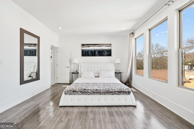 bedroom featuring recessed lighting, baseboards, and wood finished floors