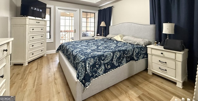 bedroom featuring light wood-style floors