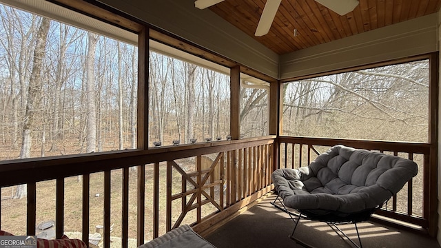 sunroom / solarium featuring wooden ceiling