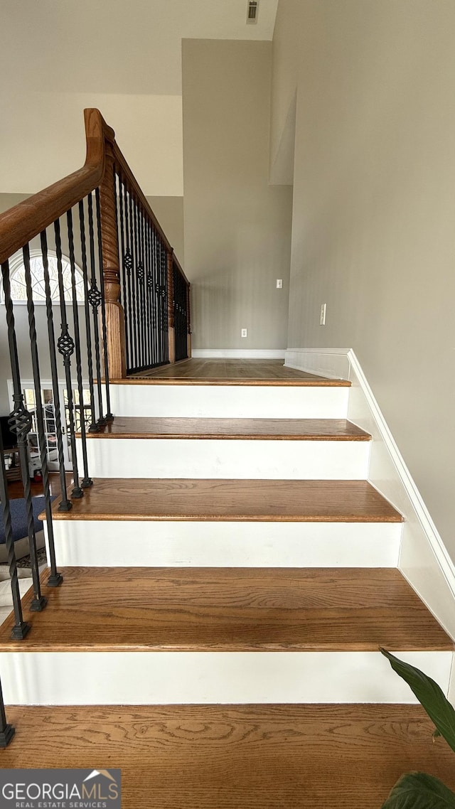 stairs featuring baseboards