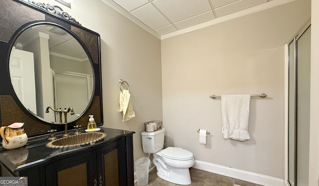 bathroom with a paneled ceiling, a shower with door, toilet, and tile patterned floors