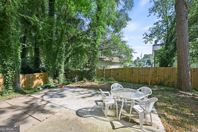 view of patio / terrace featuring outdoor dining space and a fenced backyard