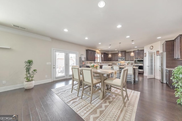 dining area with dark wood finished floors, recessed lighting, visible vents, and baseboards