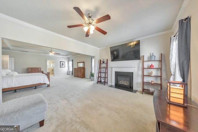 bedroom featuring crown molding, a fireplace with flush hearth, baseboards, and carpet floors