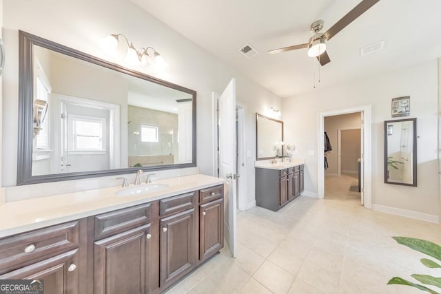 full bathroom with tile patterned floors, visible vents, baseboards, ceiling fan, and vanity