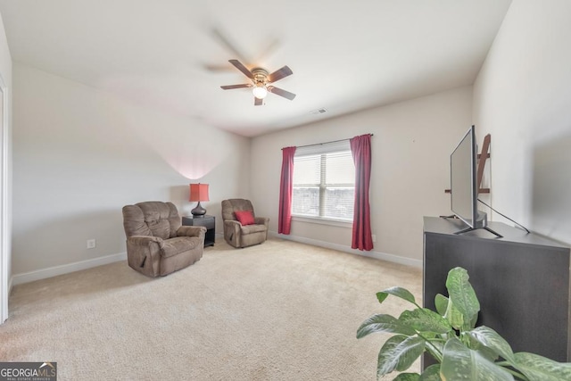 sitting room featuring visible vents, baseboards, carpet floors, and ceiling fan