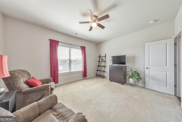 carpeted living area featuring a ceiling fan, baseboards, and visible vents