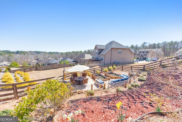 view of yard with a patio area, a residential view, and fence