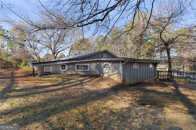 view of front of home featuring fence and board and batten siding