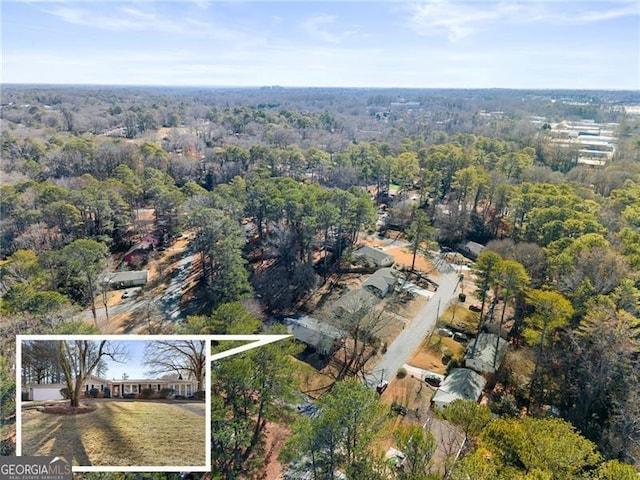 drone / aerial view with a view of trees