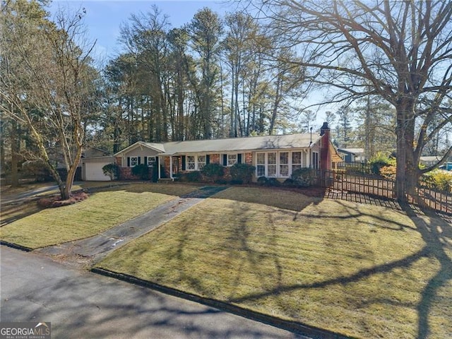 single story home featuring a front yard, fence, and a chimney