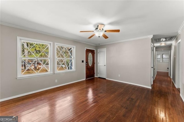 foyer with crown molding, baseboards, ceiling fan, and wood finished floors