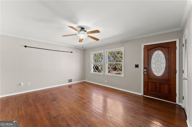 entrance foyer with crown molding, baseboards, ceiling fan, and wood finished floors