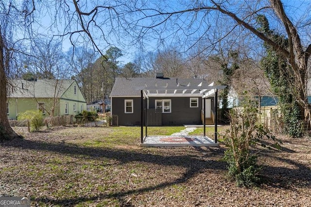 back of house with a patio area, fence, a pergola, and a yard