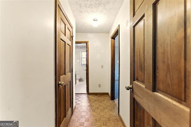 1505 Ozora Rd, Loganville, GA 30052 - corridor featuring baseboards and a textured ceiling