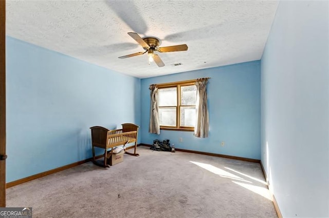 1505 Ozora Rd, Loganville, GA 30052 - sitting room featuring baseboards, visible vents, ceiling fan, and carpet flooring