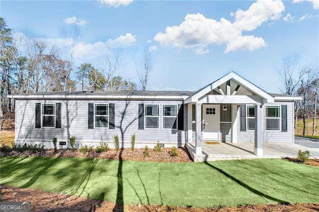 view of front of house with a front lawn and crawl space