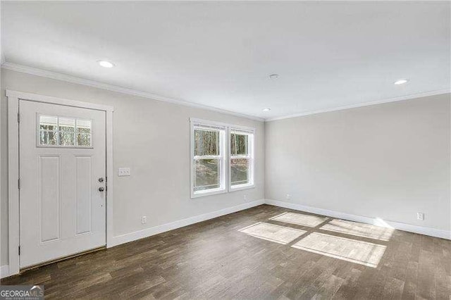 entryway featuring baseboards, ornamental molding, wood finished floors, and recessed lighting