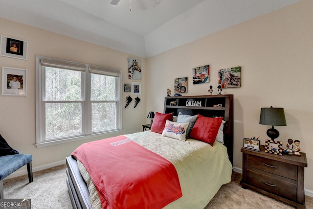 bedroom featuring a ceiling fan, light colored carpet, and baseboards