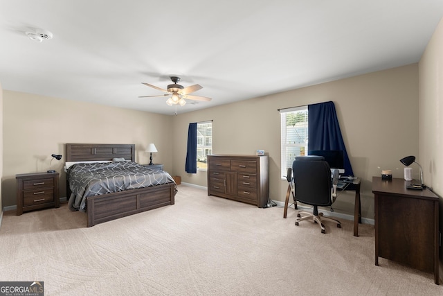 bedroom featuring a ceiling fan, baseboards, and carpet flooring