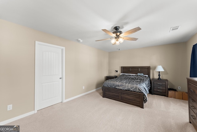 bedroom with carpet floors, visible vents, and baseboards