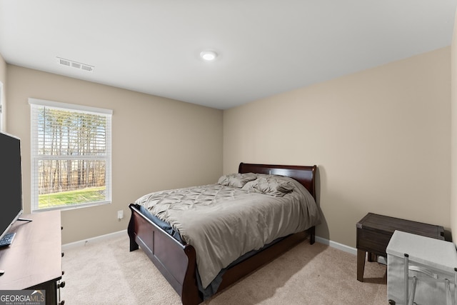 bedroom with baseboards, visible vents, and carpet flooring