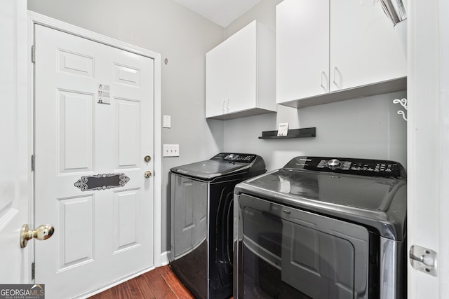 160 Deer Cliff Cv, Lawrenceville, GA 30043 - laundry area featuring dark wood-type flooring, cabinet space, and washing machine and clothes dryer