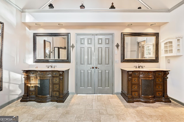 160 Deer Cliff Cv, Lawrenceville, GA 30043 - bathroom with baseboards, two vanities, and crown molding