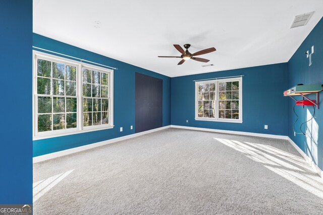 160 Deer Cliff Cv, Lawrenceville, GA 30043 - unfurnished room with visible vents, a healthy amount of sunlight, carpet, and ceiling fan