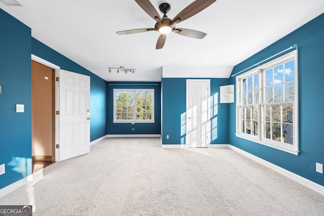 160 Deer Cliff Cv, Lawrenceville, GA 30043 - empty room with visible vents, ceiling fan, carpet, baseboards, and rail lighting