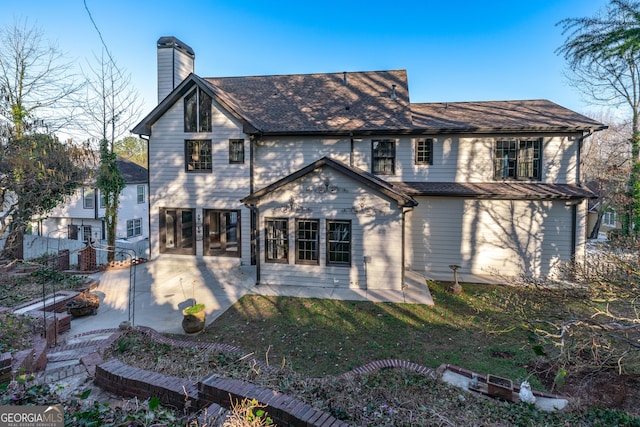 160 Deer Cliff Cv, Lawrenceville, GA 30043 - rear view of house with a lawn, a chimney, and a patio