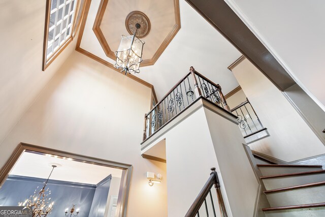 160 Deer Cliff Cv, Lawrenceville, GA 30043 - stairs featuring a high ceiling and a notable chandelier