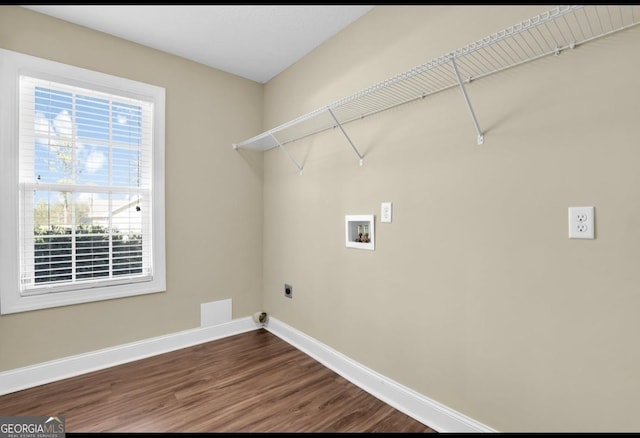 laundry room with laundry area, baseboards, wood finished floors, hookup for a washing machine, and hookup for an electric dryer