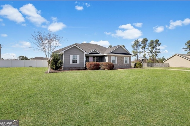 single story home featuring fence and a front yard