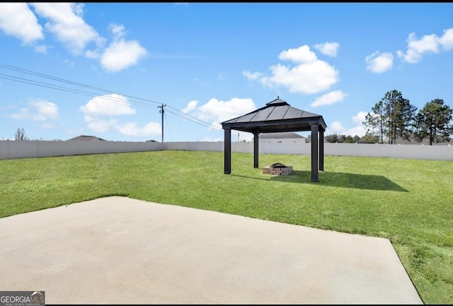 view of patio featuring an outdoor fire pit, a fenced backyard, and a gazebo