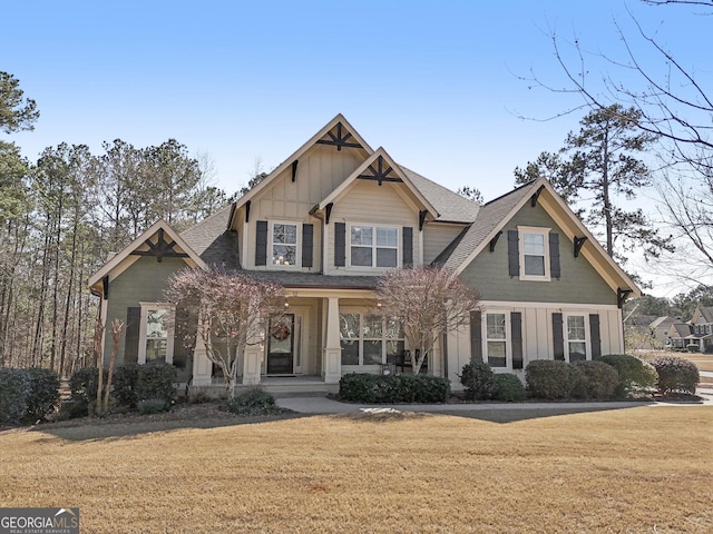 craftsman-style house featuring board and batten siding and a front lawn