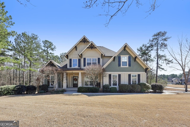 craftsman-style house with a front lawn and board and batten siding