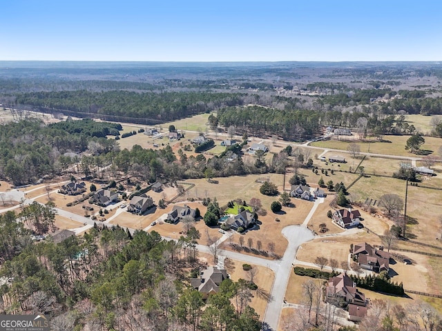 bird's eye view featuring a forest view