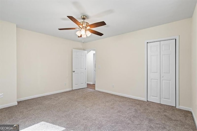 1270 Graymont Dr, Atlanta, GA 30310 - unfurnished bedroom featuring carpet flooring, a ceiling fan, a closet, and baseboards