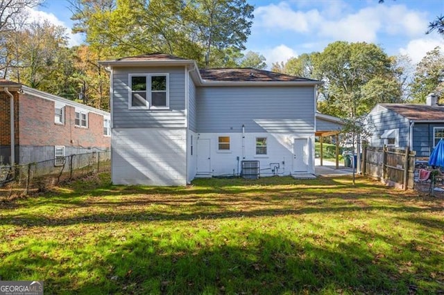 1270 Graymont Dr, Atlanta, GA 30310 - rear view of property featuring central air condition unit, fence, and a yard
