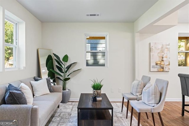 1270 Graymont Dr, Atlanta, GA 30310 - living area featuring baseboards, visible vents, and wood finished floors