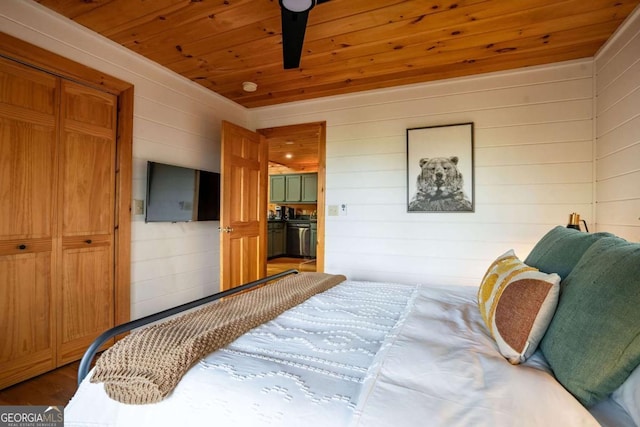 bedroom with wooden ceiling and wood finished floors